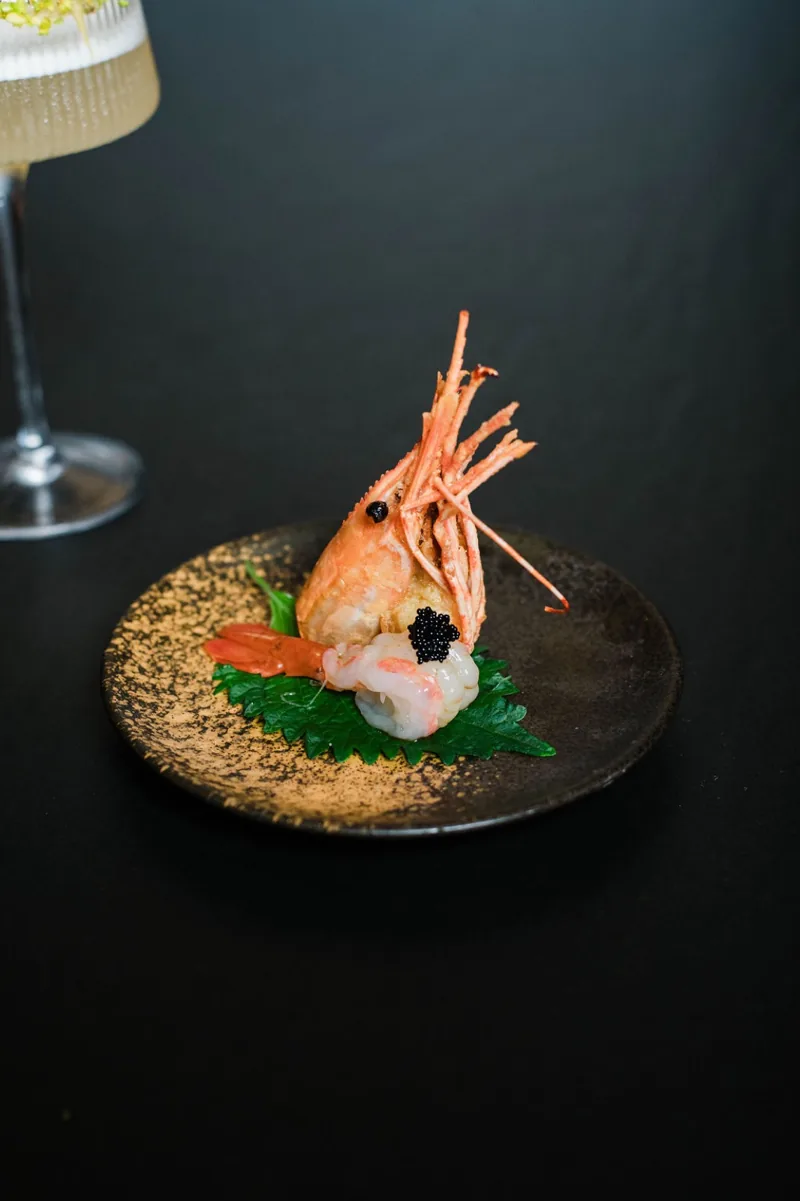 A shrimp course at the counter