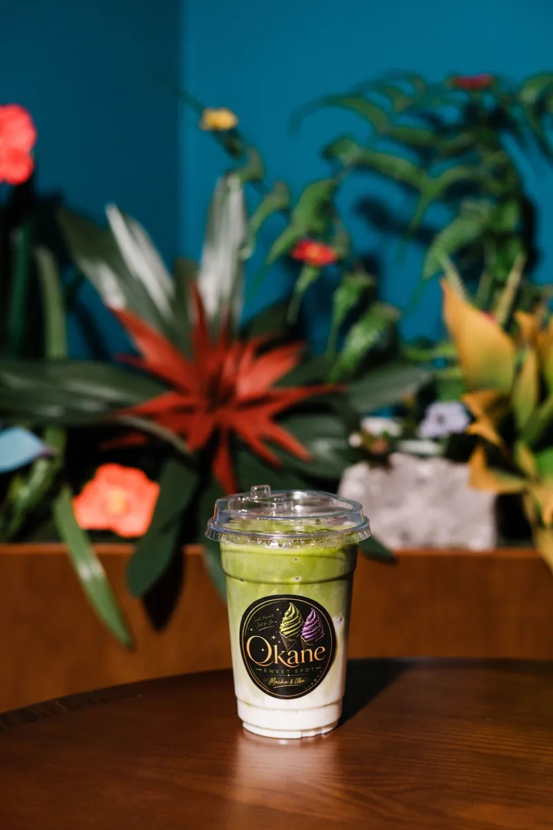 Iced matcha latte against the Sweet Spot greenery