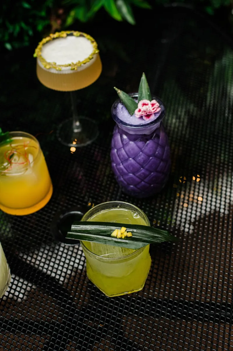 Cocktails on a rooftop table at golden hour